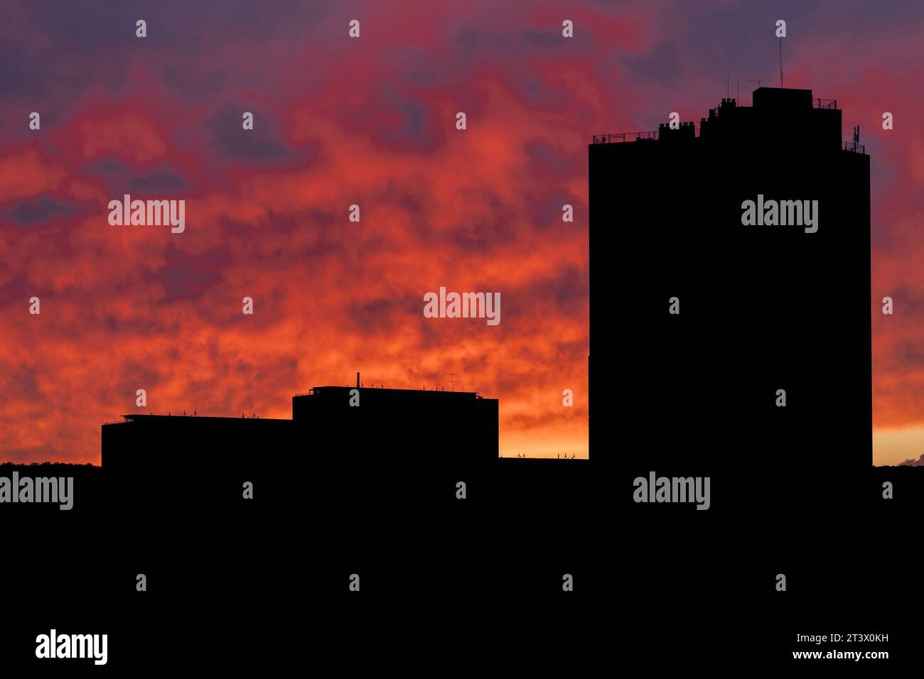 Silhouette of buildings in orange sky during sunset Stock Photo - Alamy
