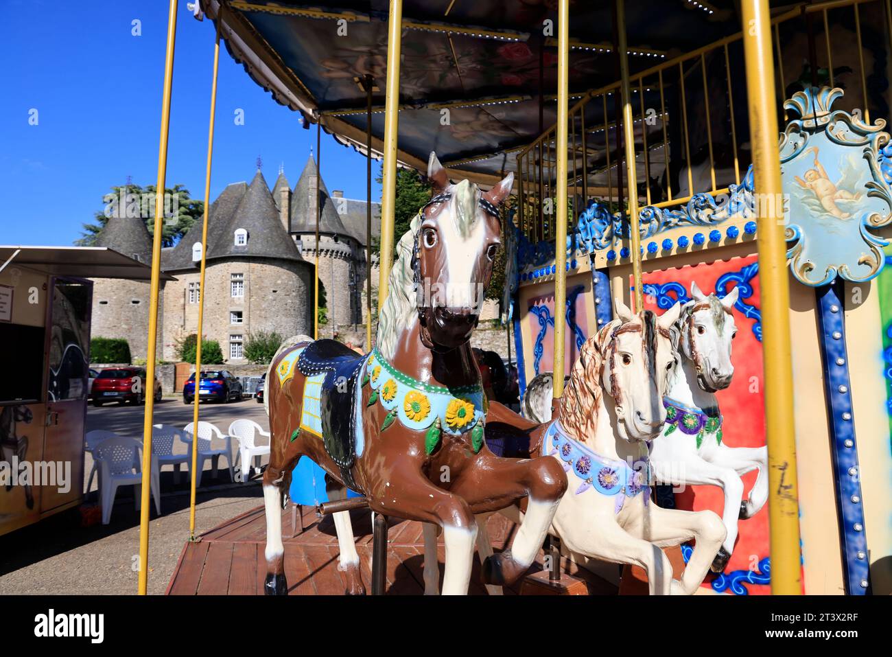 Wooden horses from the carousel in front of the Château de Pompadour, the City of Horses. Arnac-Pompadour, Corrèze, Limousin, France, Europe. Photo by Stock Photo