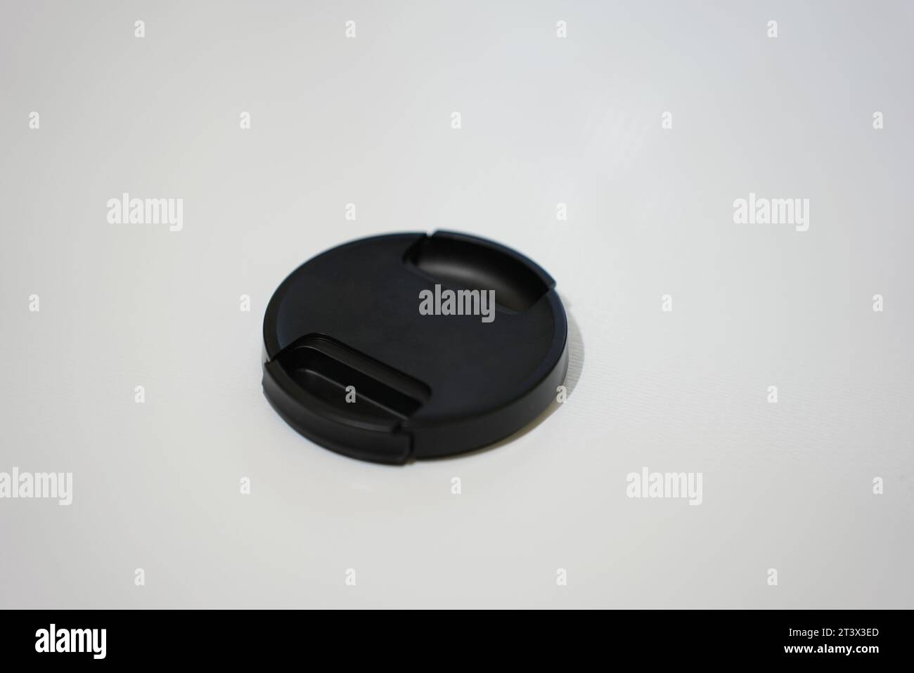 black lens cap with white background Stock Photo
