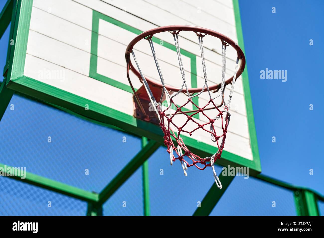 A basketball hoop on a outdoor court Stock Photo