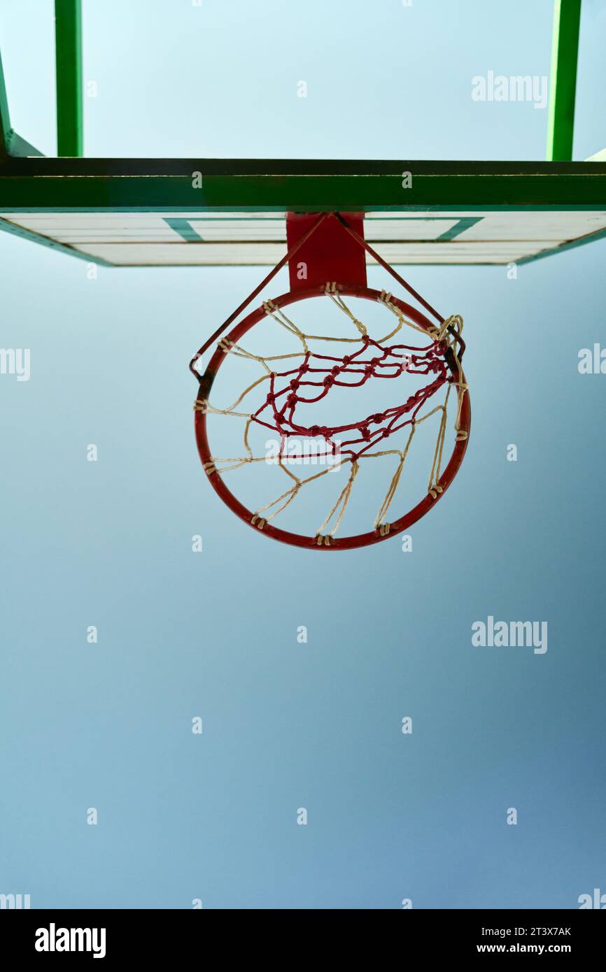 A basketball hoop on a outdoor court Stock Photo