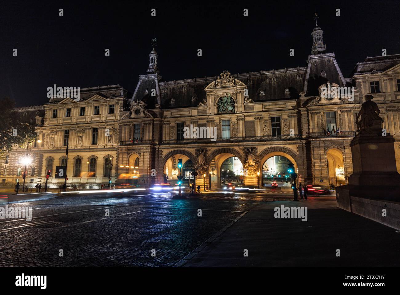 Long exposure scene at night of the Louvre Museum in Paris, France. Stock Photo