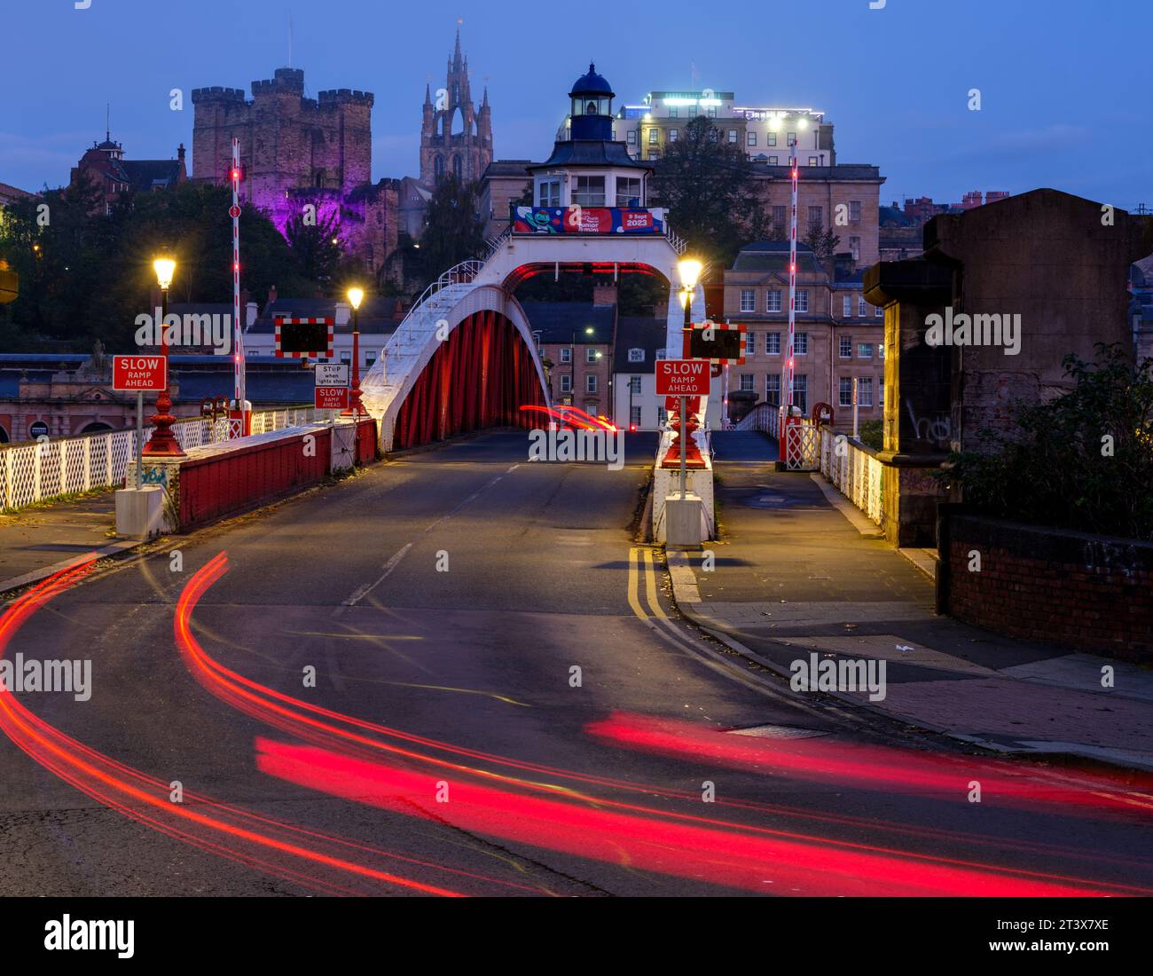 Car lght trails of morning rush hour traffic crossing the Swing Bridge into Newcastle upon Tyne Stock Photo
