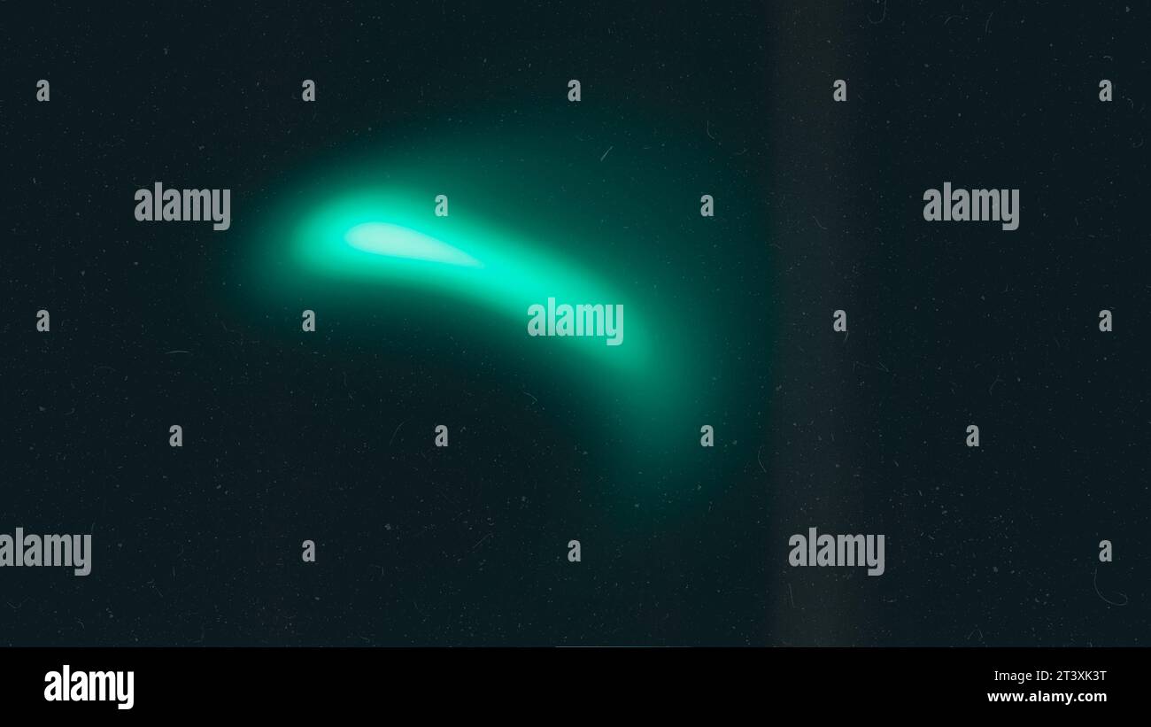 Green emerald color gradient grainy background. Illuminated spots on