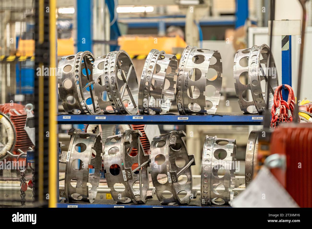 engine parts of various diameters in the rack at the factory Stock ...