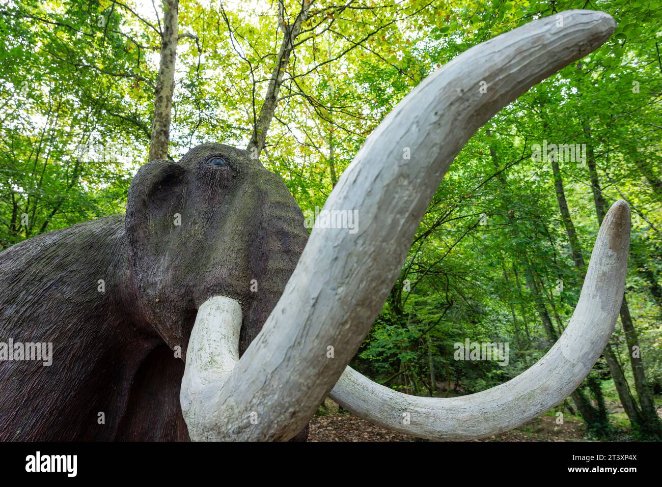 figure of a life-size mammoth, Paleolithic Park of the Cueva del Valle, Rasines, Cantabria, Spain. Stock Photo