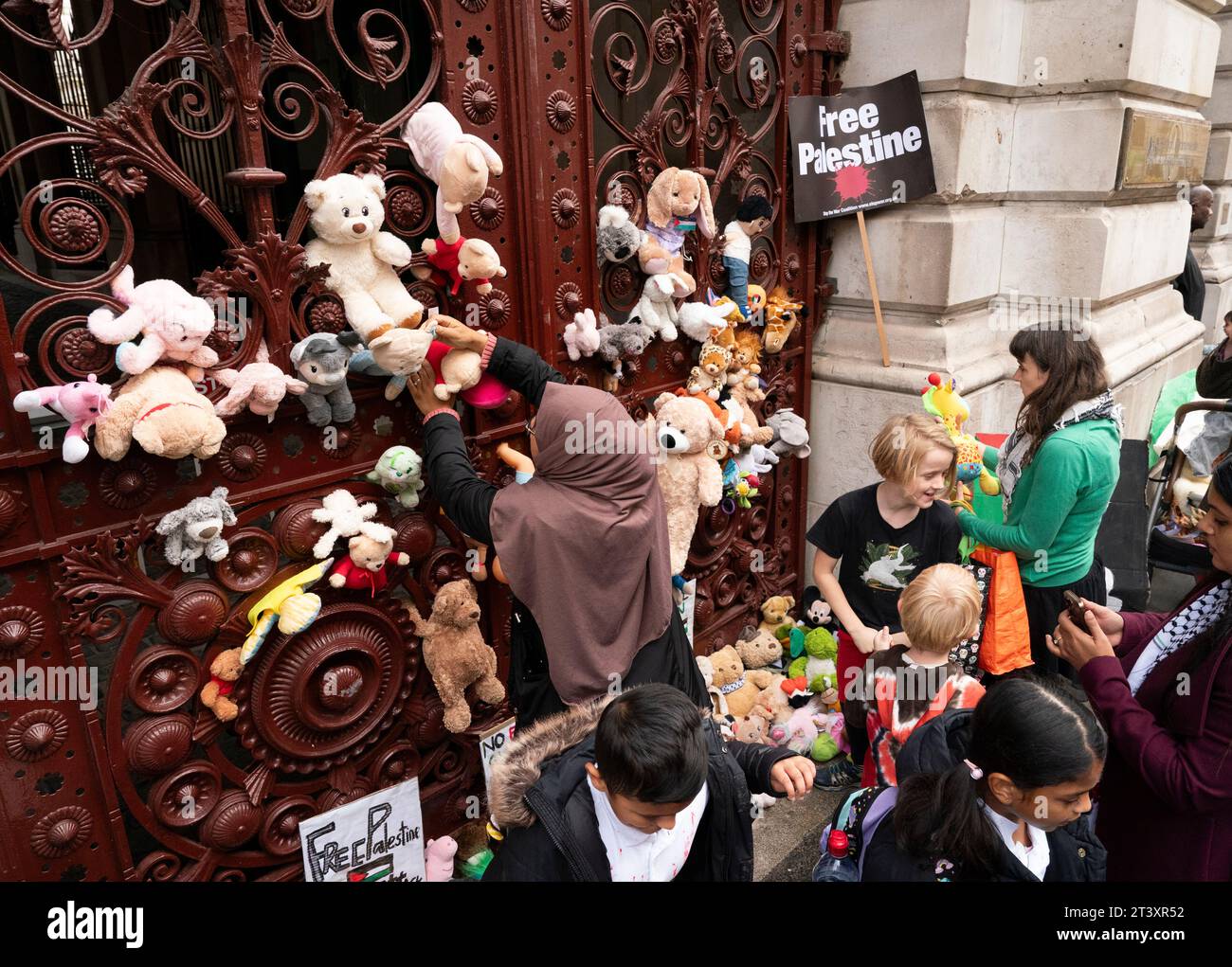 Parents And Children Lay Out Cuddly Toys Across The Entrance To The ...