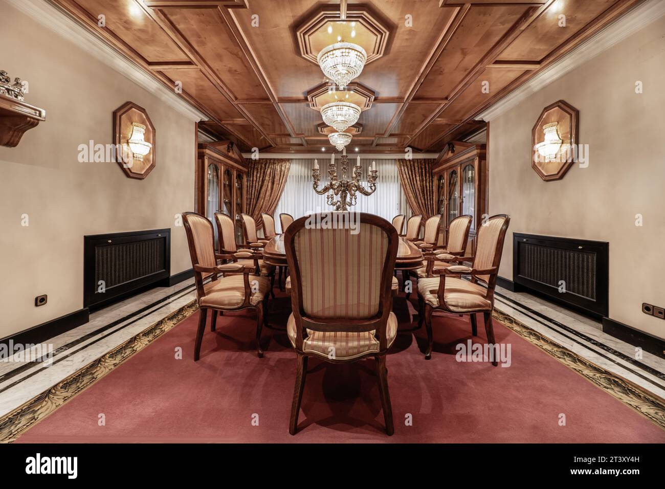 Vintage style dining room with matching wooden ceiling with chairs and