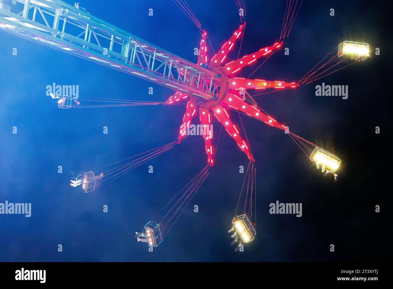 People enjoying a fairground ride at