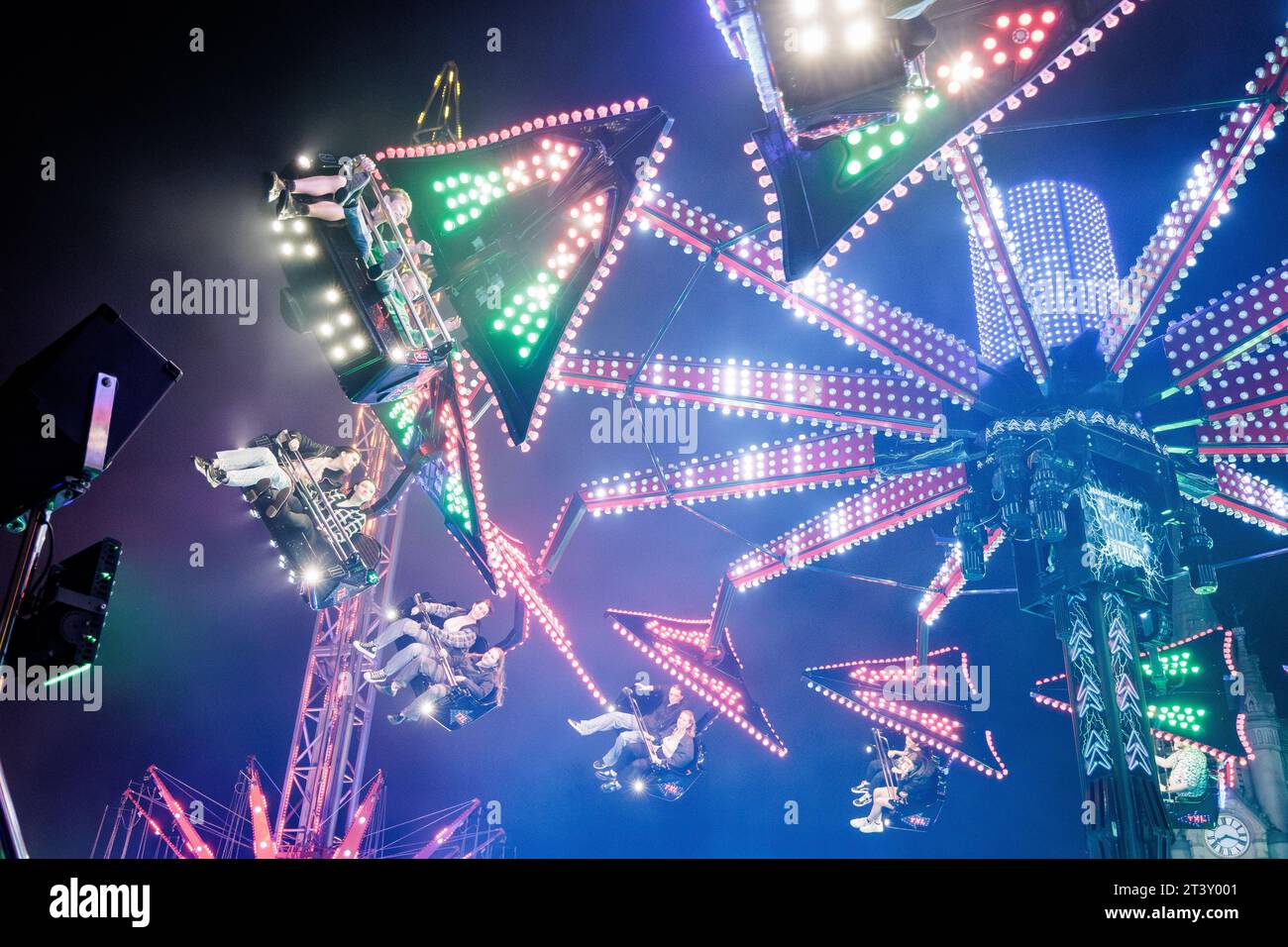 People enjoying a fairground ride at