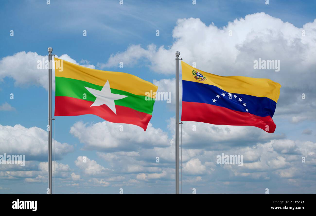 Venezuela and Myanmar flags waving together in the wind on blue cloudy ...