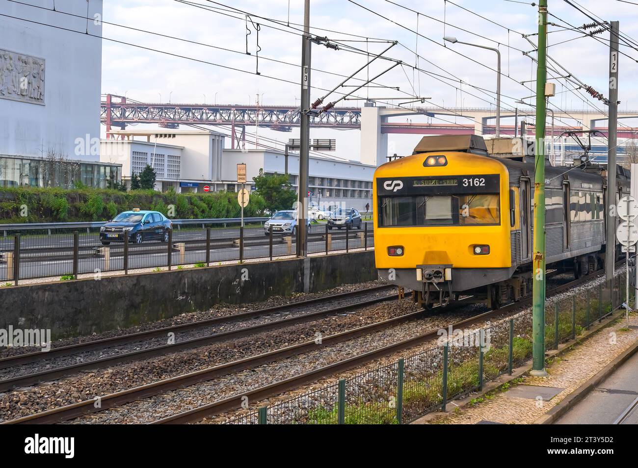 A public transportation train moving in railroad tracks in the Belem District Stock Photo