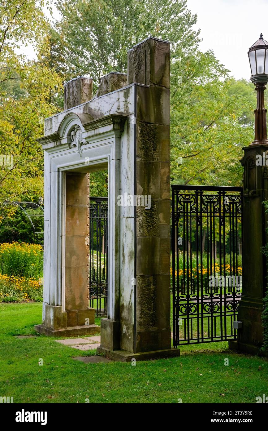 Toronto, Canada, Ancient stone gate and metallic fence. The local