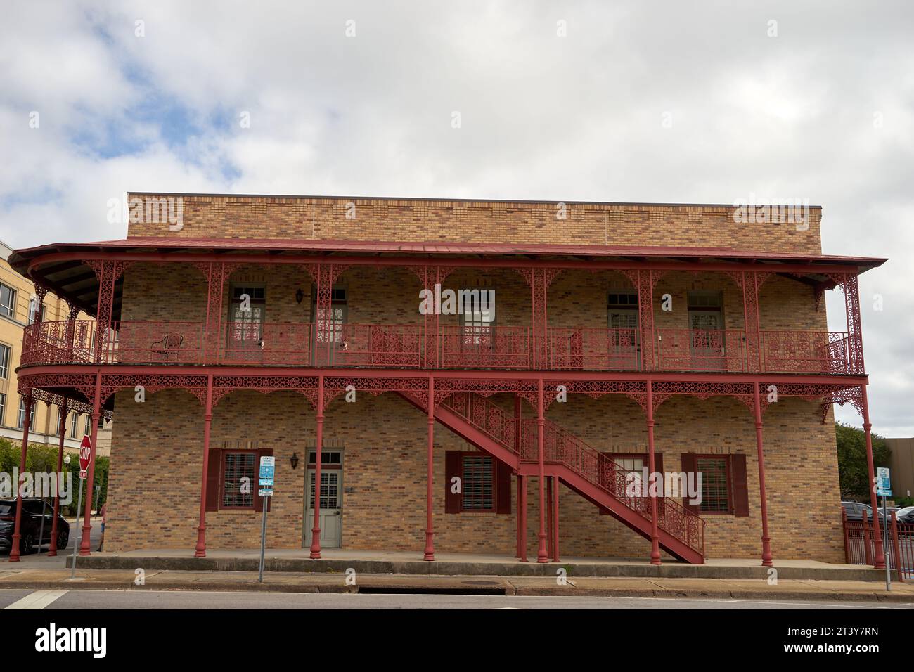 the exterior of 25 West Government Street, a charming New Orleans style architecture, across