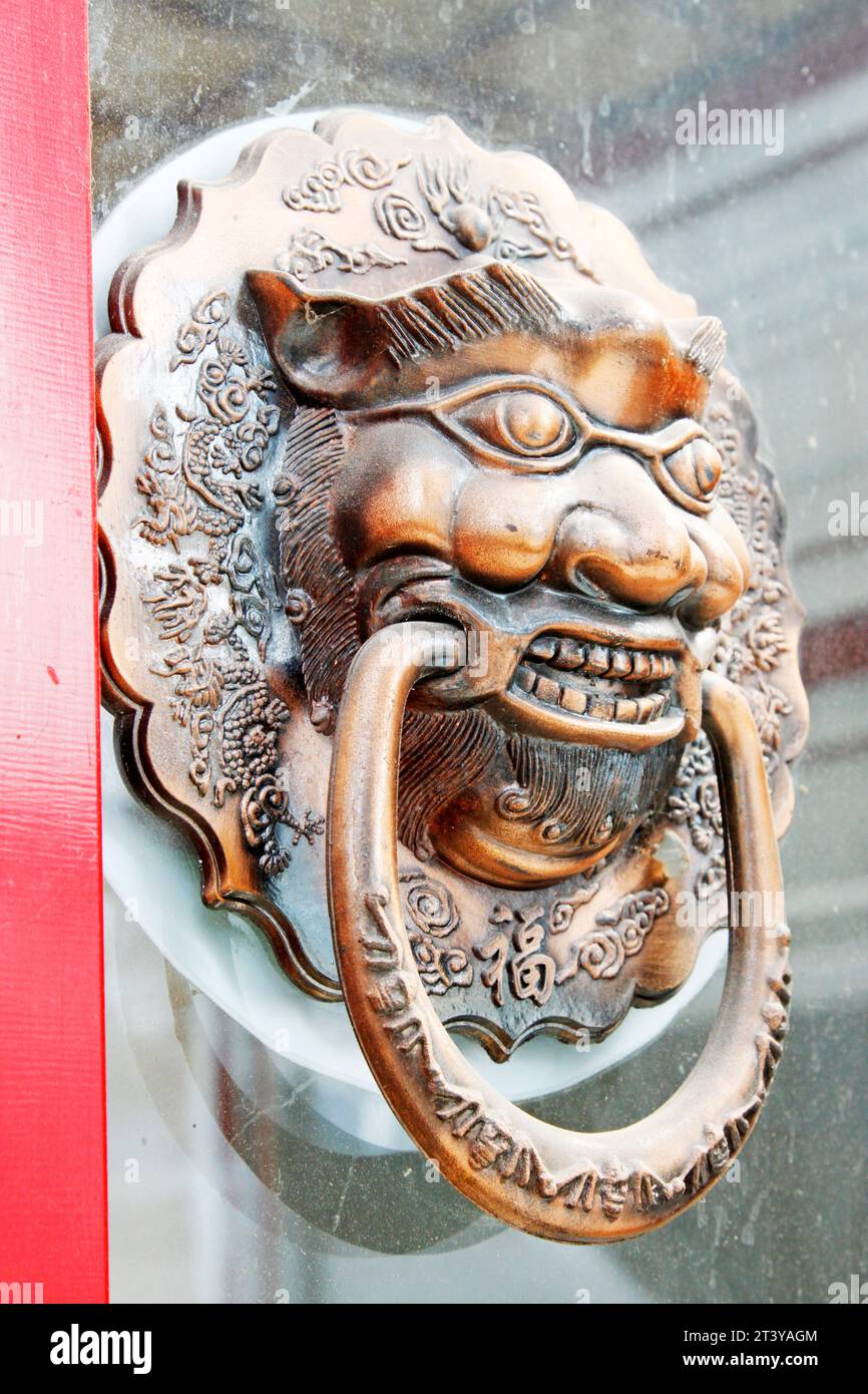 metal animal heads on the door, Chinese traditional style Stock Photo Alamy