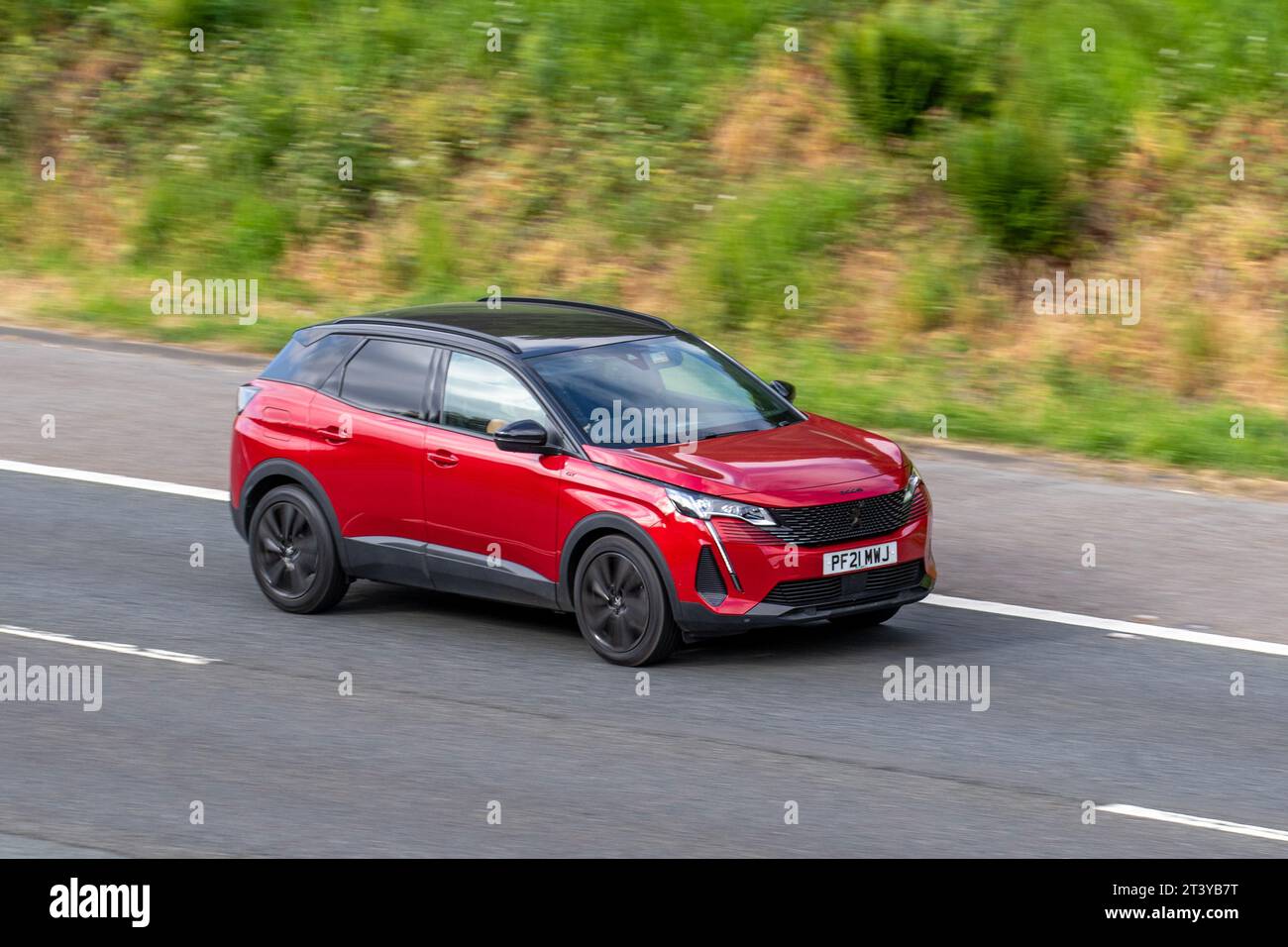 2021 Peugeot 3008 Gt Prem P-Tech S/S A Puretech 180 EAT8 Auto Start/Stop Red Car SUV Petrol 1598 cc travelling at speed on the M6 motorway in Greater Manchester, UK Stock Photo