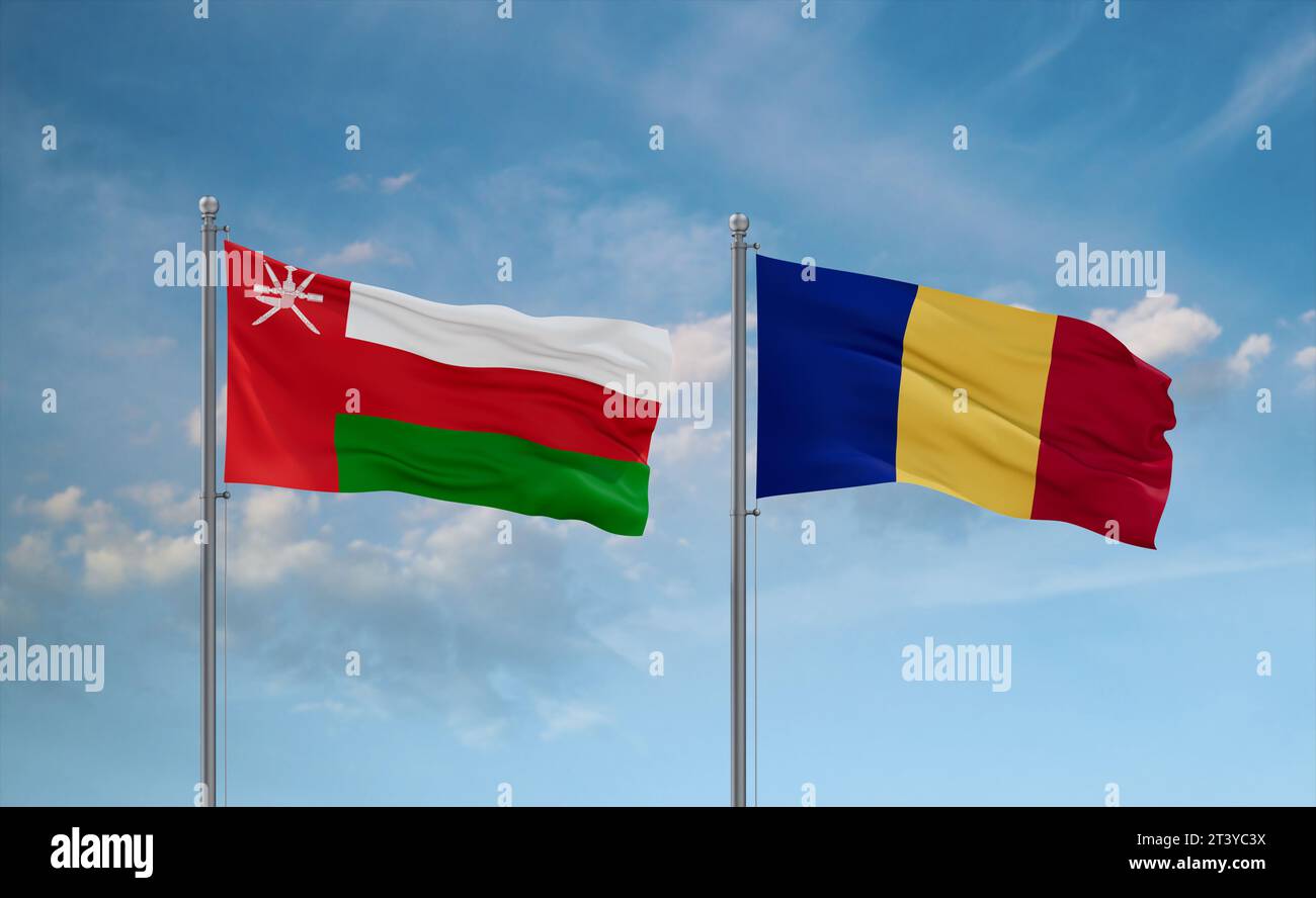 Republic of Chad and Oman flags waving together in the wind on blue cloudy sky, two country relationship concept Stock Photo