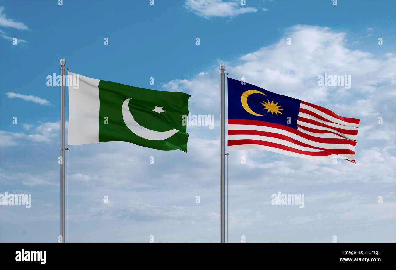 Malaysia and Pakistan flags waving together in the wind on blue cloudy ...