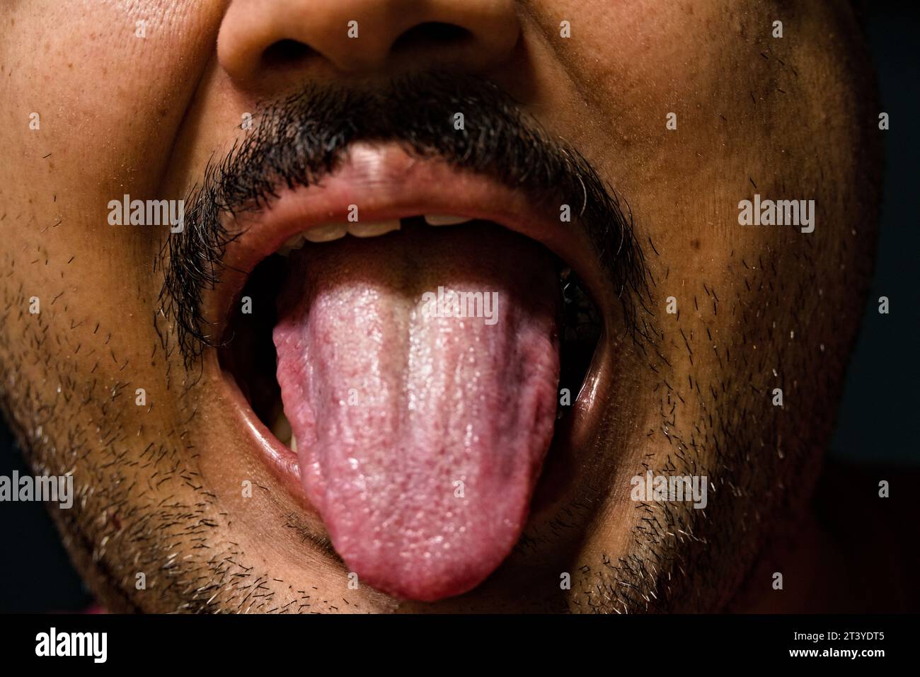 partially blurred photo of tongue of a indian adult male Stock Photo