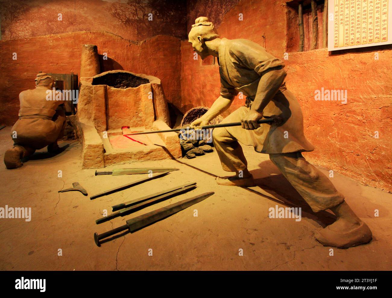 TANGSHAN - NOVEMBER 16: The Han iron smelting sculpture in the kailuan museum, november 16, 2013, tangshan, hebei province, china. Stock Photo