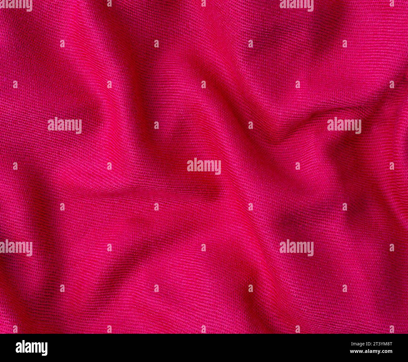 wrinkled pink fabric texture background close-up Stock Photo