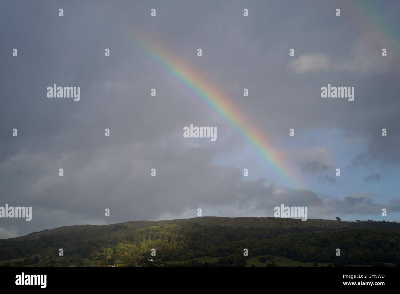 A view of a rainbow above Cleeve Hill from Cheltenham Racecourse. Picture date: Friday October 27, 2023. Stock Photo
