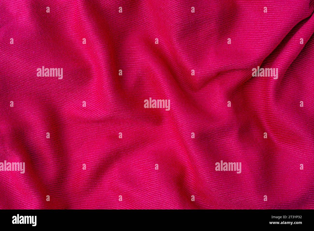wrinkled pink fabric texture background close up Stock Photo