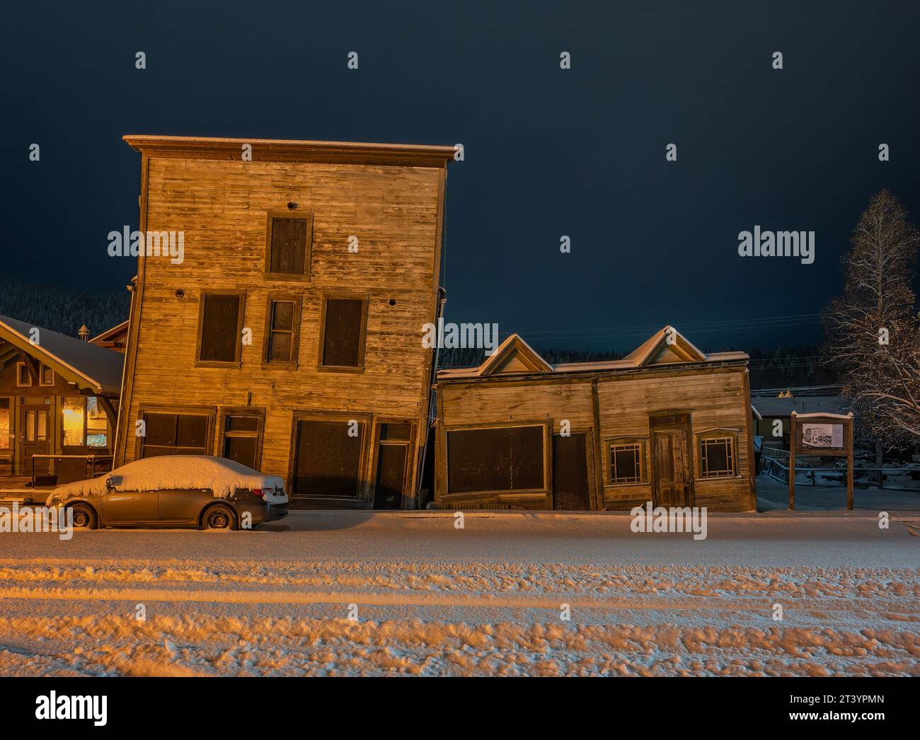 Night view of historic facades in Dawson City, Yukon, Canada Stock Photo