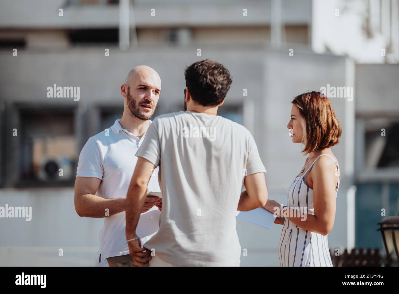 Successful Collaboration: Architects and Engineers Discussing Modern Architectural Design Stock Photo