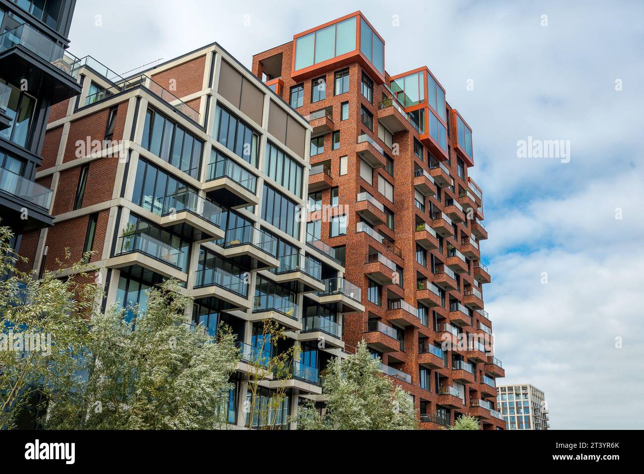 Modern housing building with balconies and brick facade Stock Photo - Alamy