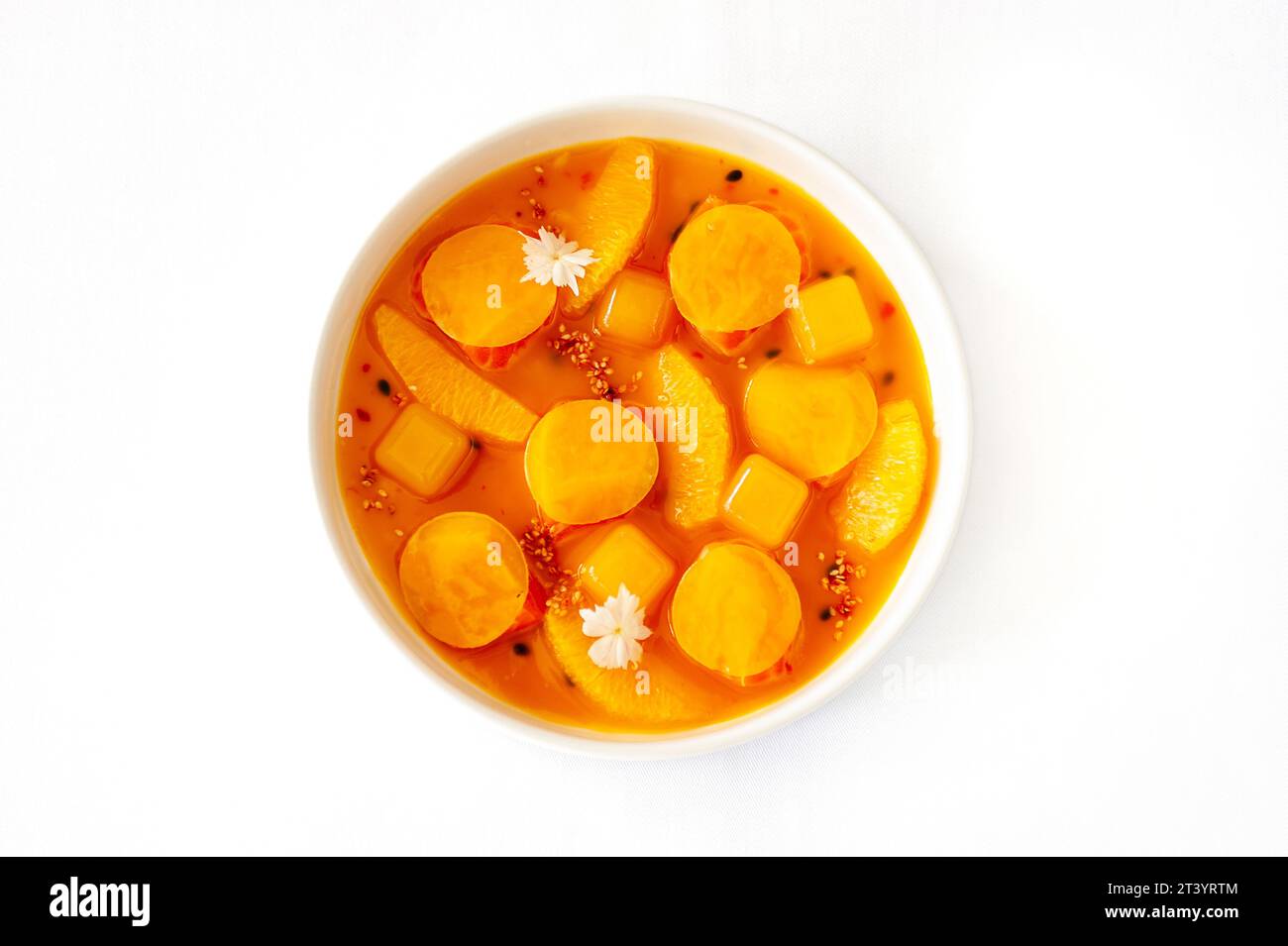 Salmon ceviche in jelly with orange and mango-passion fruit sauce isolated Stock Photo