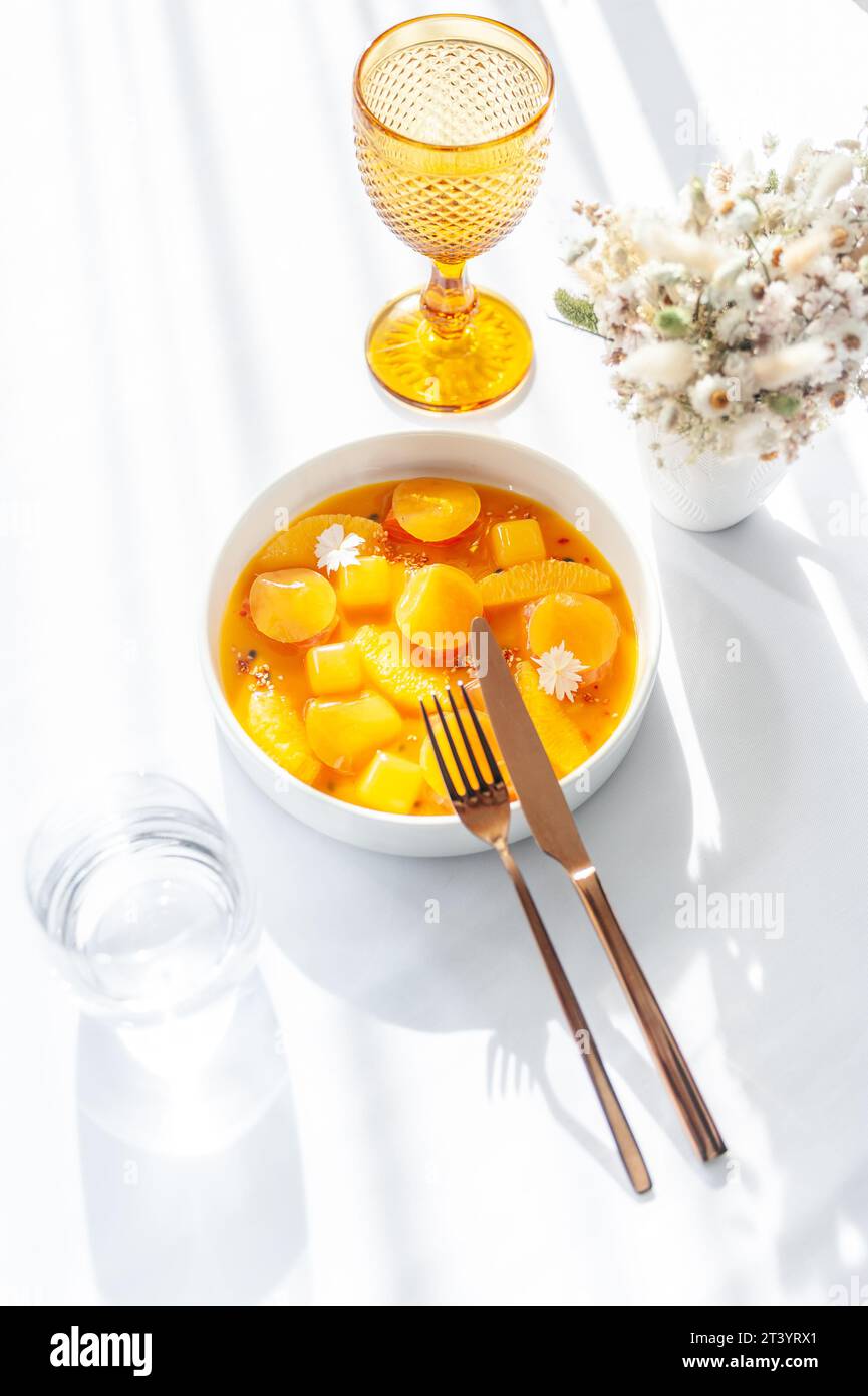 Salmon ceviche in jelly with orange and mango-passion fruit sauce Stock Photo