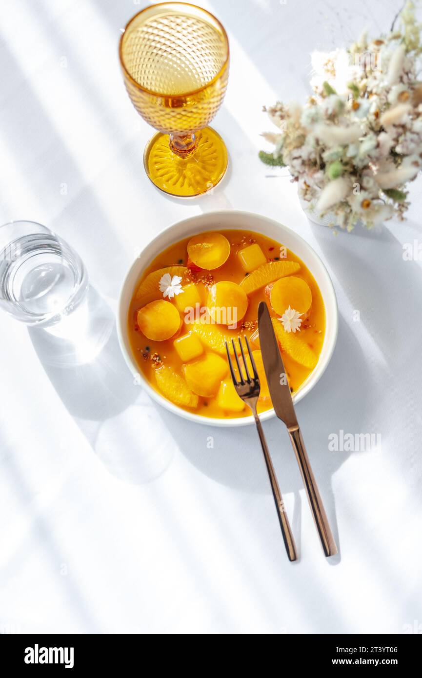 Salmon ceviche in jelly with orange and mango-passion fruit sauce Stock Photo