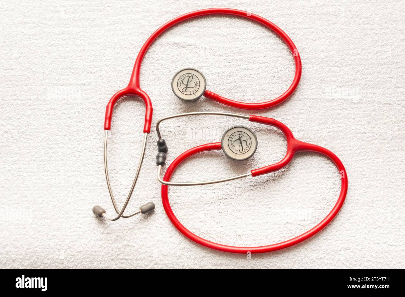 A pair of  Littmann Classic III monitoring stethoscopes (red) Stock Photo