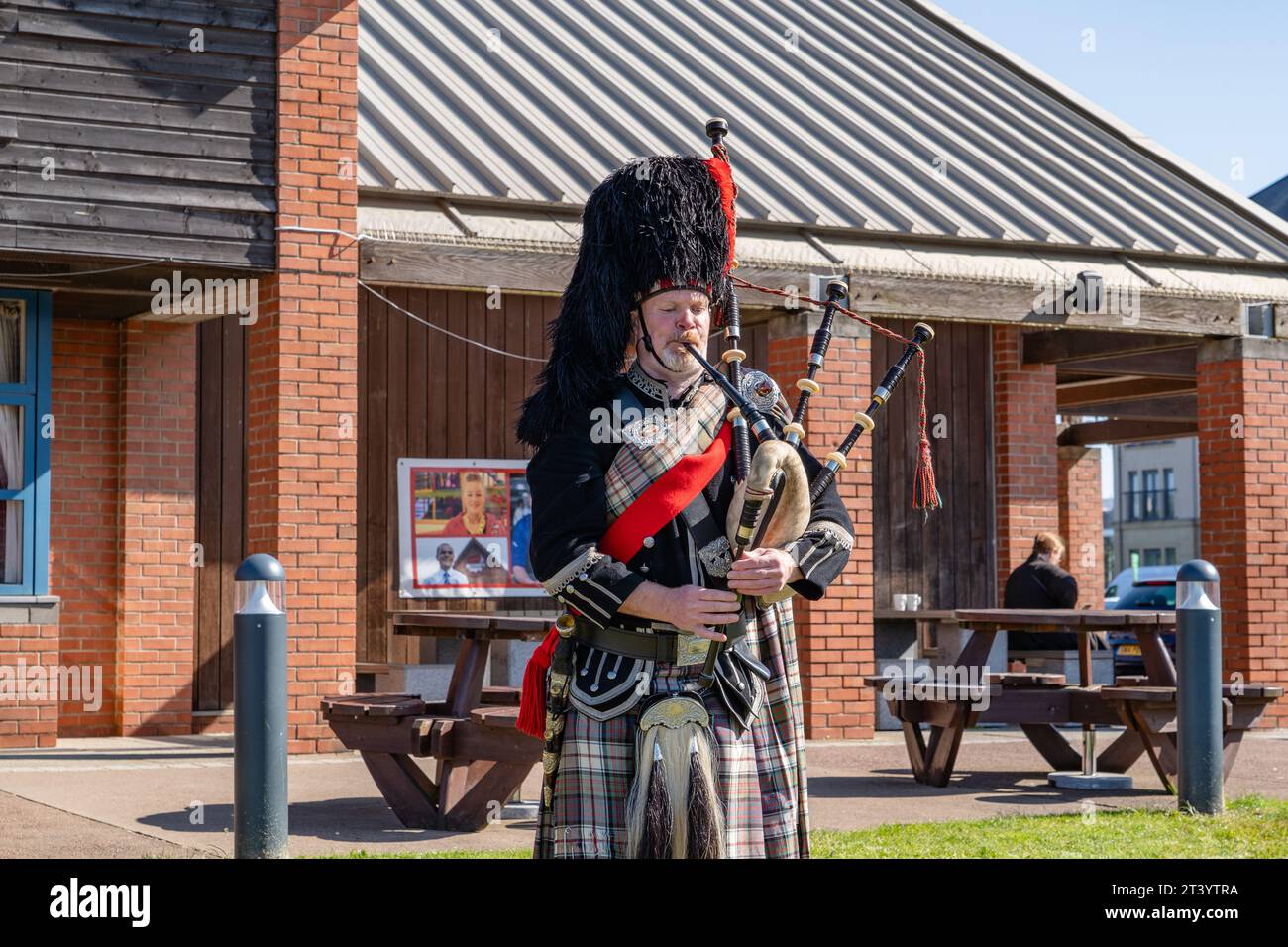 Traditional Scotsman playing a bagpipe in Edinburgh, Scotland Stock Photo