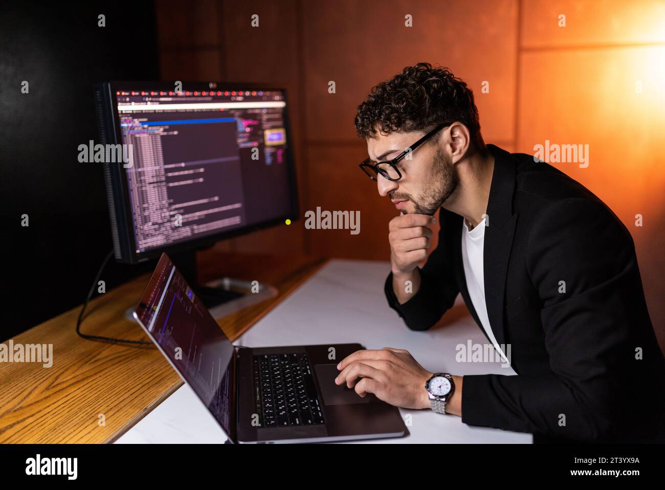 Laptop, screen and business man for coding, software development and programming script in cybersecurity. Night, computer research and programmer or I Stock Photo