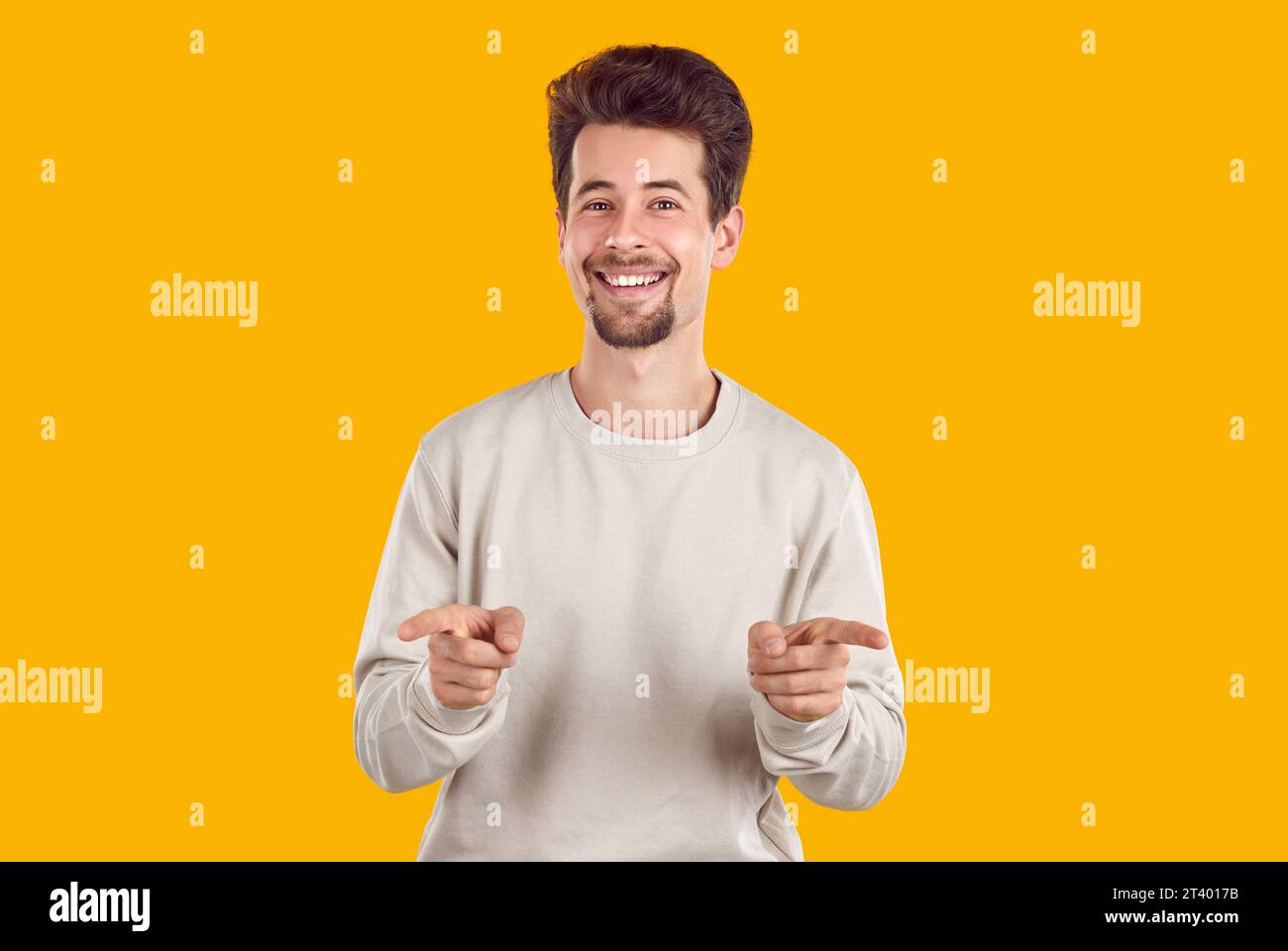 Happy handsome man pointing camera hi-res stock photography and images ...