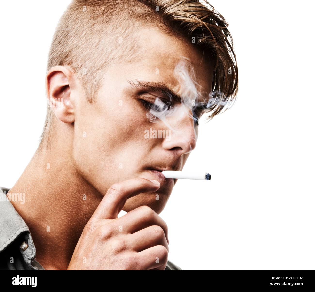 Face, studio or man smoking a cigarette for stress, toxic addiction or unhealthy habit to relax