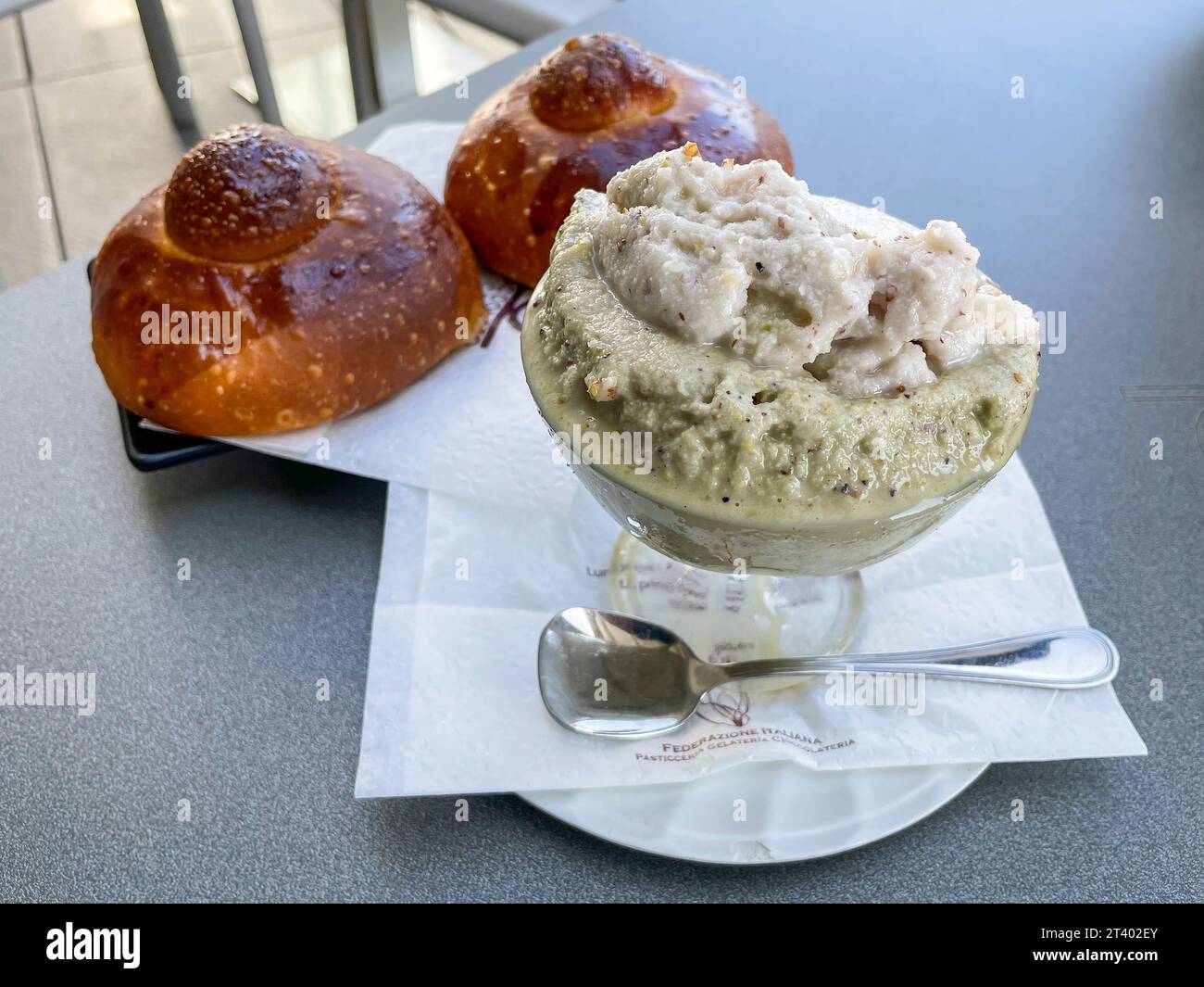 Premium Photo  Traditional sicilian granita coffee flavor with brioche  close up