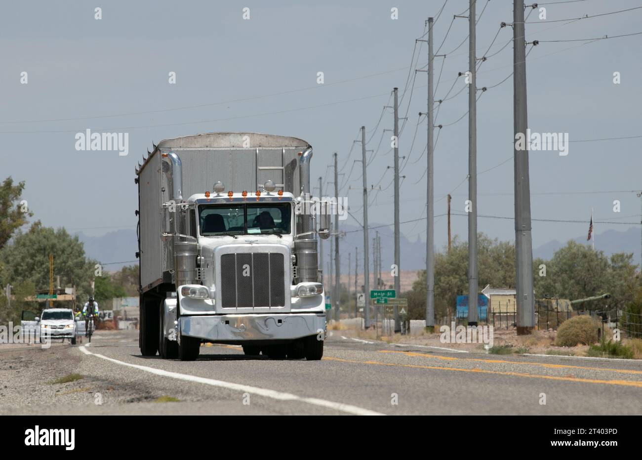 Big white truck in hot Arizona road Stock Photo
