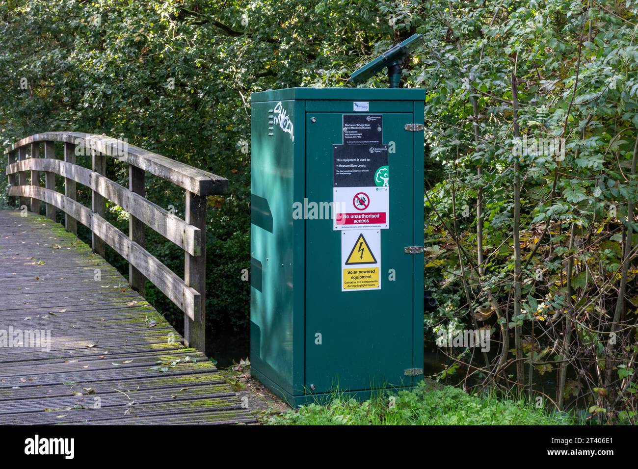 Solar-powered river level monitoring station on the River Blackwater at Blackwater Bridge in Camberley, Surrey, England, UK Stock Photo
