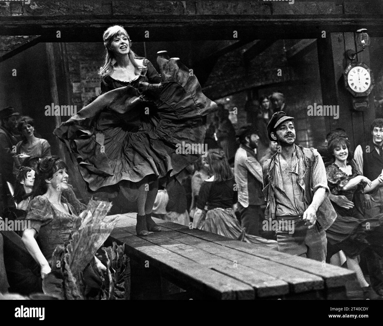 Shani Wallis (dancing on table), on-set of the British musical film, 'Oliver!', Columbia Pictures, 1968 Stock Photo
