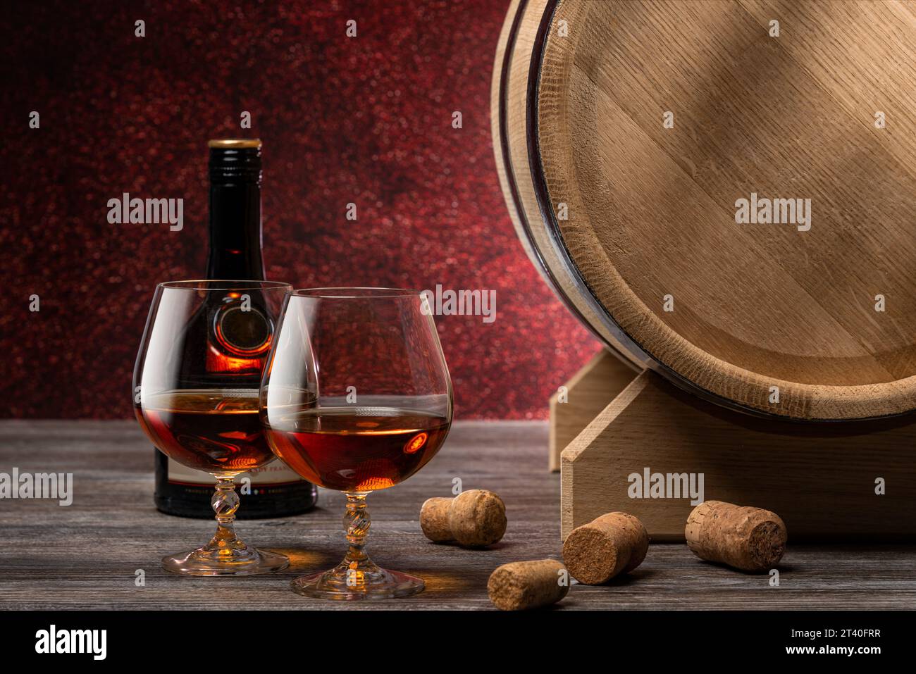 Brandy glasses and bottle near wooden barrel in pub Stock Photo Alamy