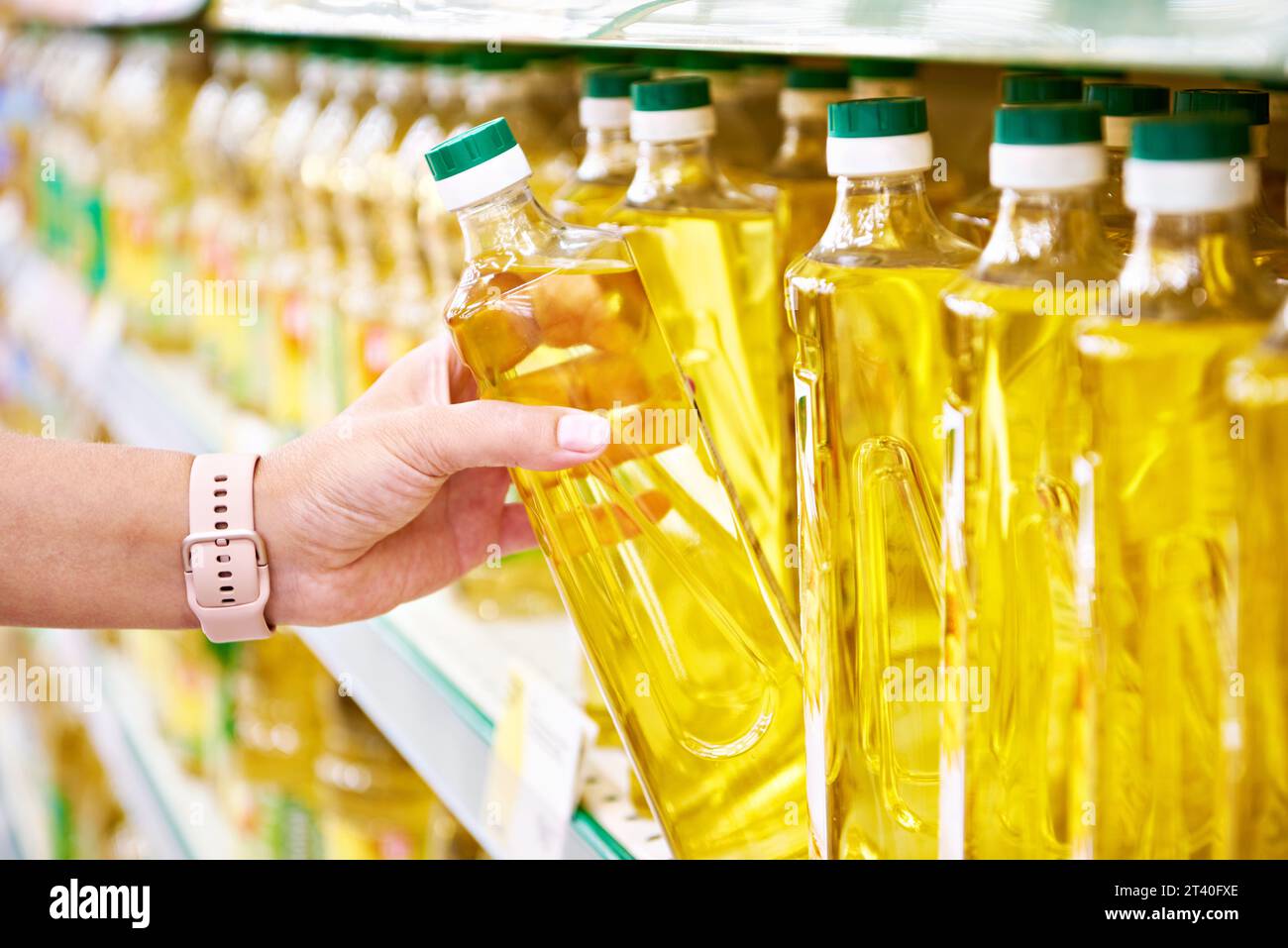 Sunflower oil in the hands of a buyer in a store Stock Photo Alamy