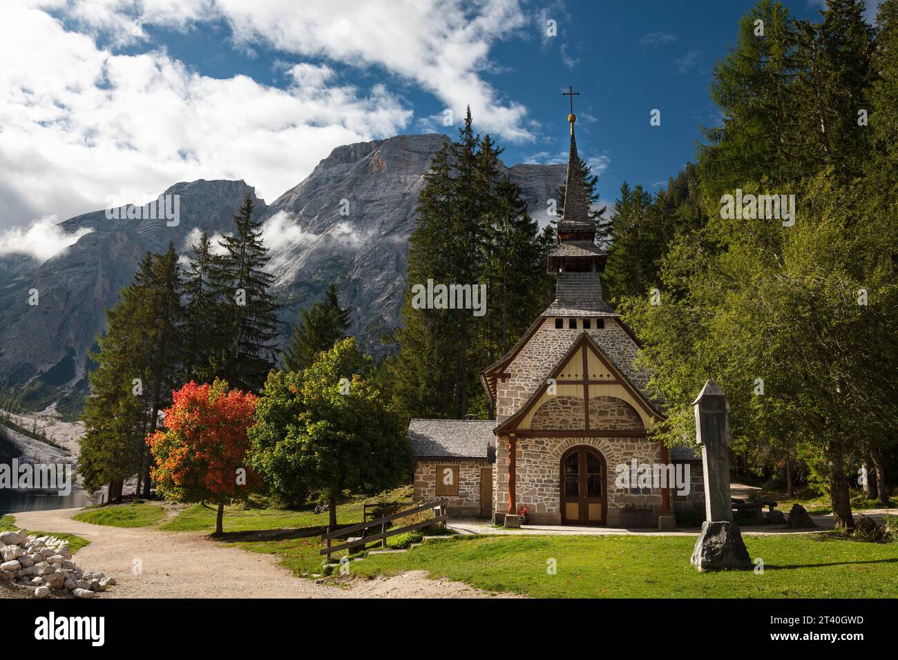 'Marienkapelle am Pragser Wildsee' also known as the Chapel of our lady is a small Catholic chapel located on the shores of Lago di Braies, Dolomites. Stock Photo