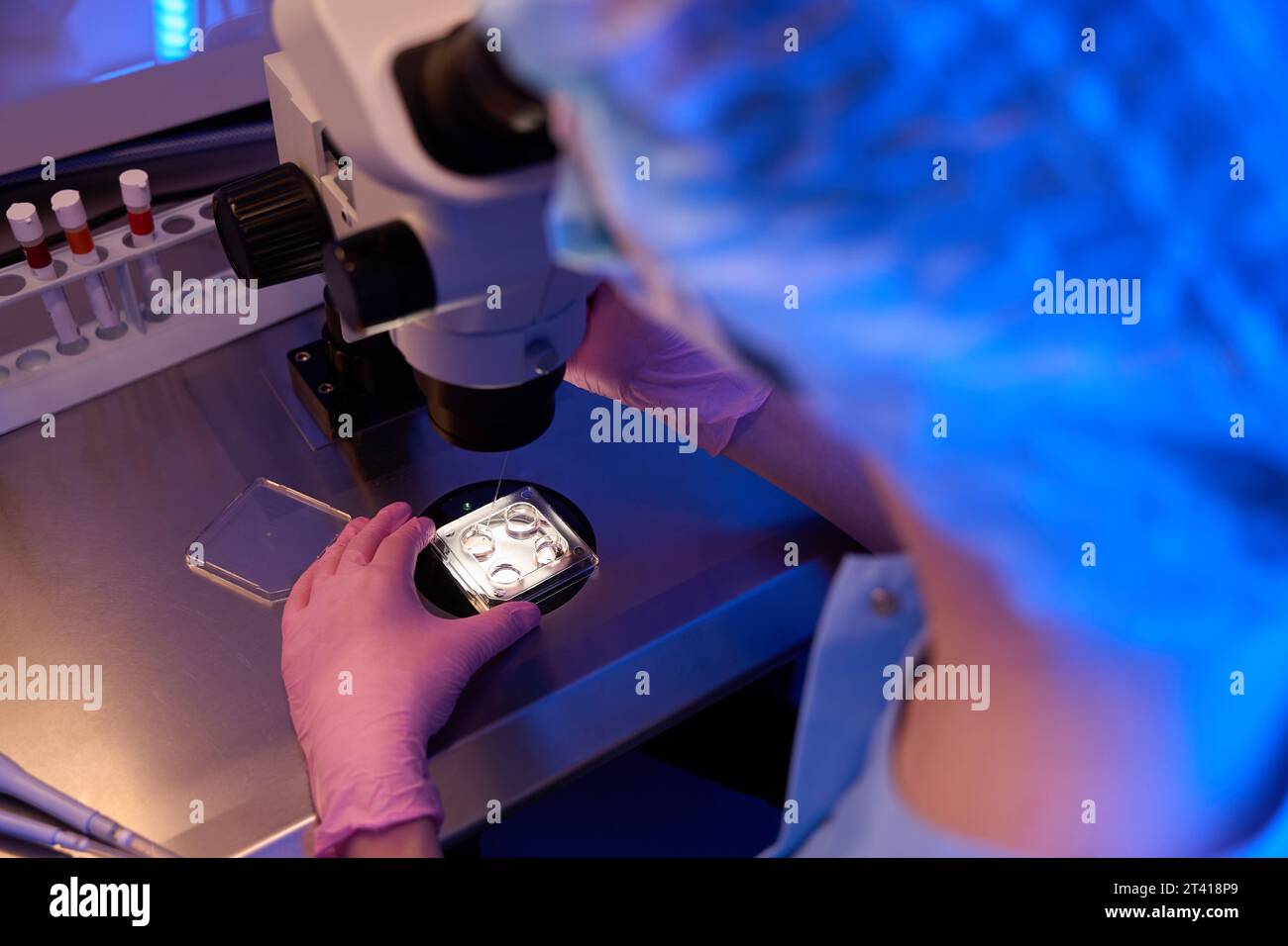 Lab carrying out micropipette cell aspiration under microscope Stock Photo Alamy