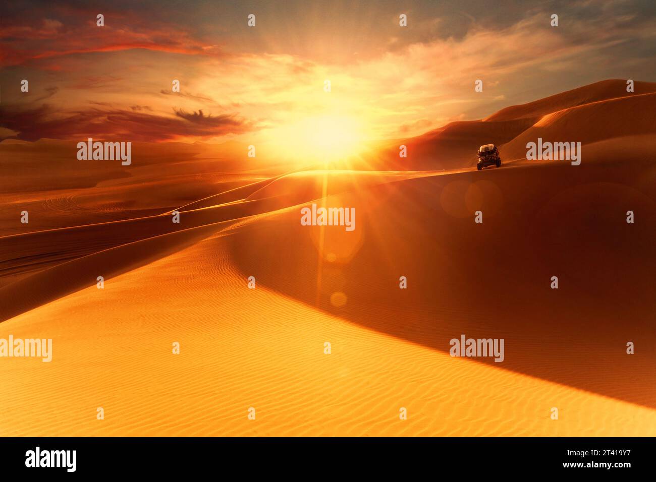 Sunset in the desert and a buggy. Dunes of Ica Peru Stock Photo