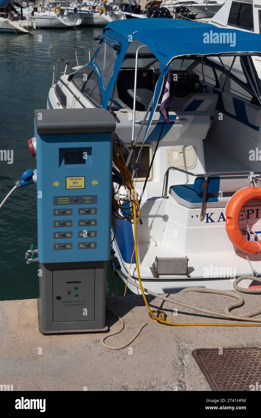 Heraklion, Crete, Greece. 26.09.2023.  Boating marina water and electricity control point  alongside boat on the berth . Stock Photo