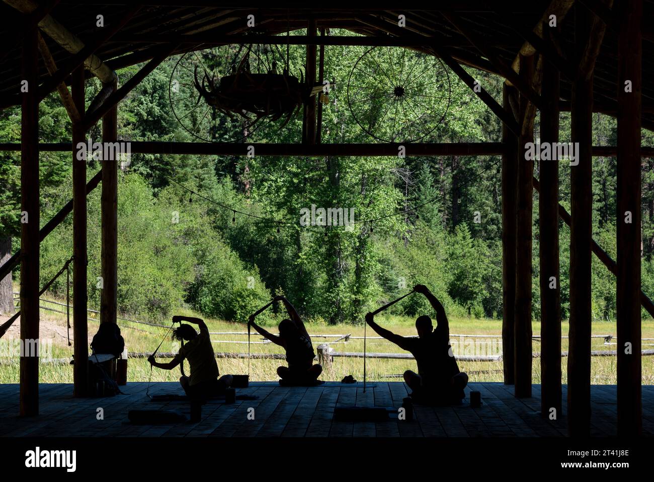 Yoga in the pole barn of the Minam River Lodge, Oregon. Stock Photo