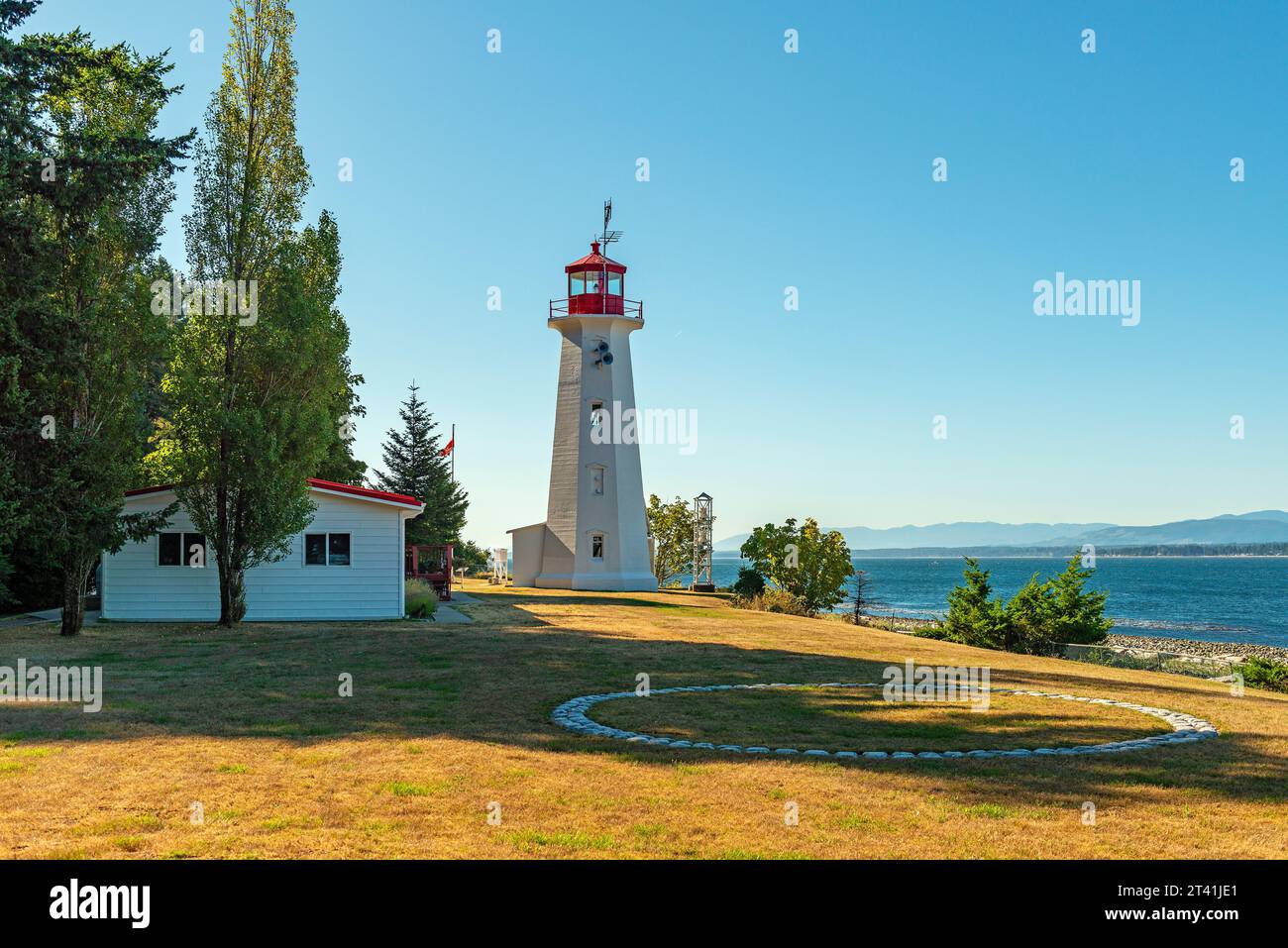Cape Mudge town lighthouse by the Discovery Passage, Quadra Island, British Columbia, Canada. Stock Photo